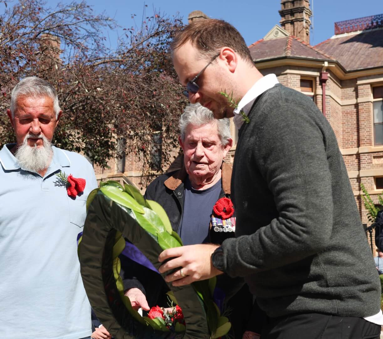 Leonard with his son, and Allied Health Coordinator Adriaan Rossouw